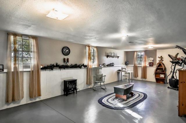 5901 Rotary Road Cherry Valley, IL 61016 - Photo 14 of 19 a living room with furniture kitchen view and a window
