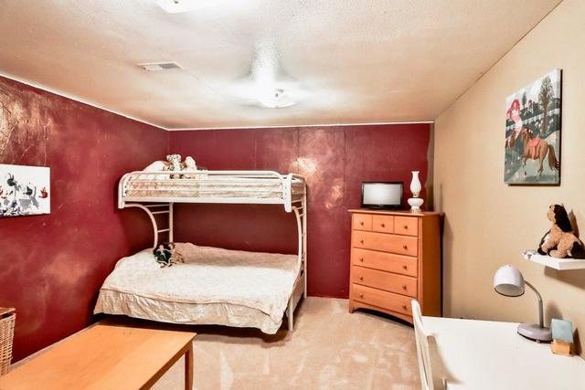 5901 Rotary Road Cherry Valley, IL 61016 - Photo 15 of 19 a bedroom with a bed and a lamp on dresser