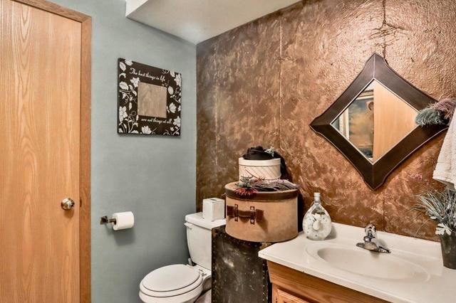 5901 Rotary Road Cherry Valley, IL 61016 - Photo 16 of 19 a bathroom with a toilet sink and mirror