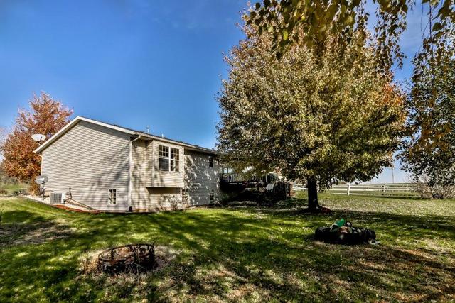 5901 Rotary Road Cherry Valley, IL 61016 - Photo 18 of 19 a view of a garden with large trees