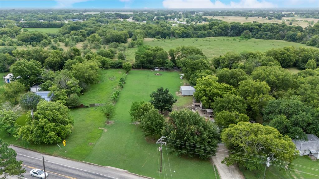 571 South 1st Street Point, TX 75472 - Photo 24 of 27 an aerial view of green landscape with trees houses and lake view
