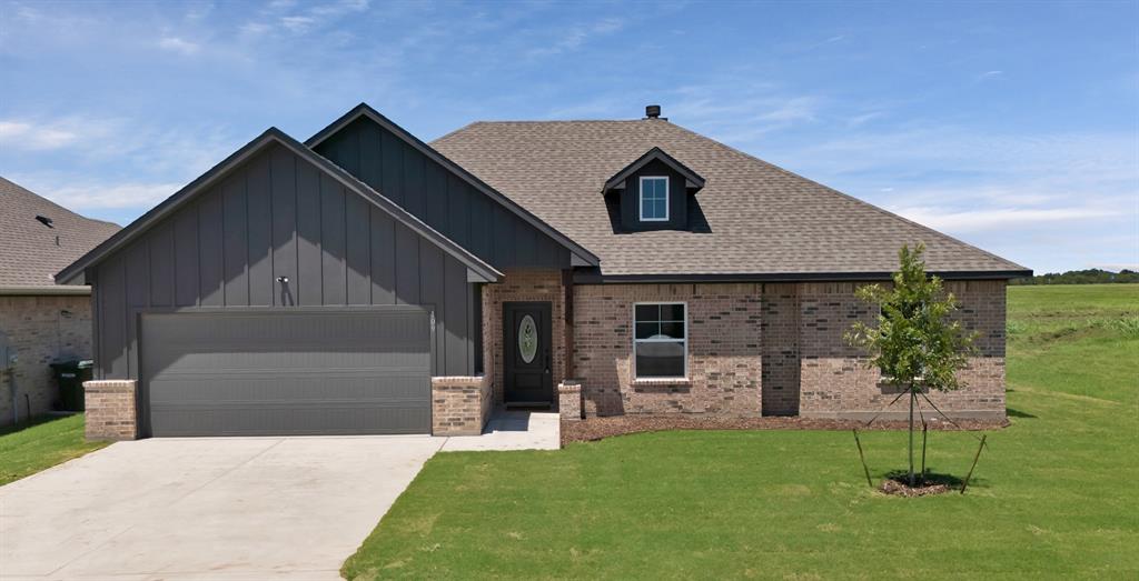 113 Panther Loop Mabank, TX 75147 - Photo 1 of 15 a front view of a house with a yard