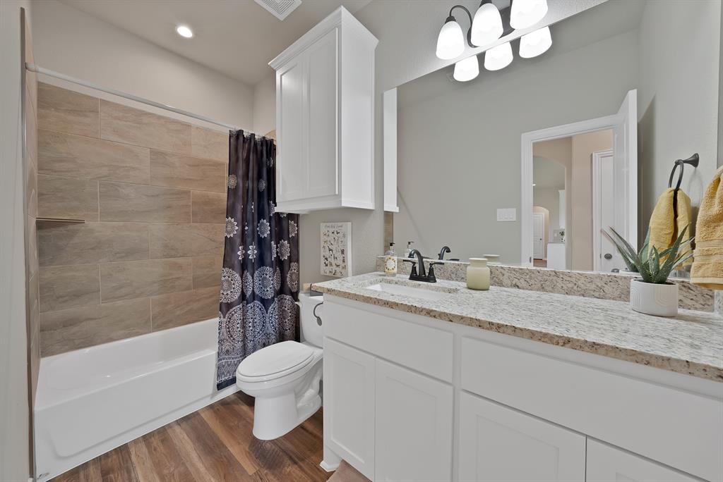 113 Panther Loop Mabank, TX 75147 - Photo 10 of 15 a bathroom with a sink a toilet and shower