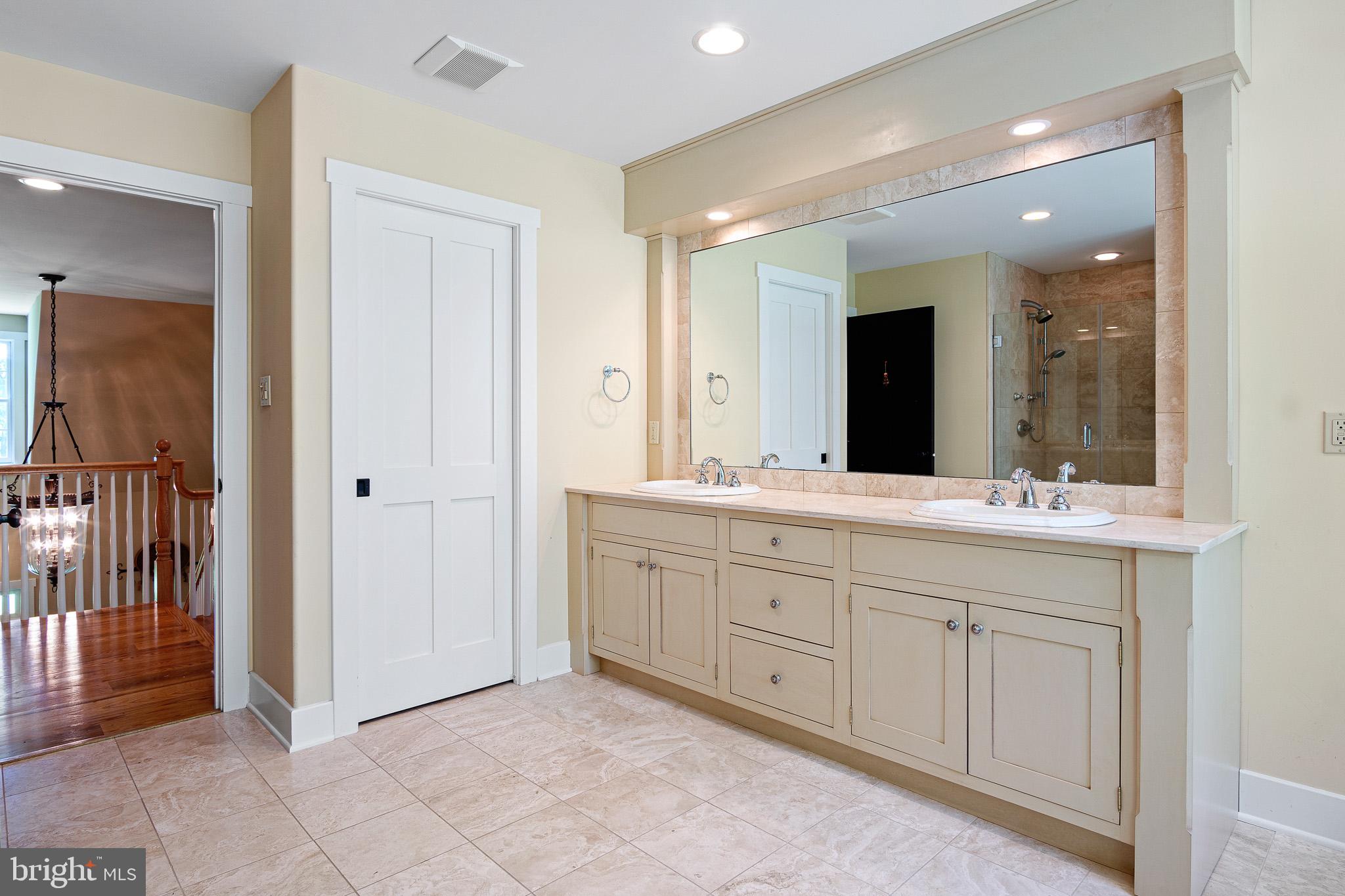 a bathroom with a granite countertop sink mirror and