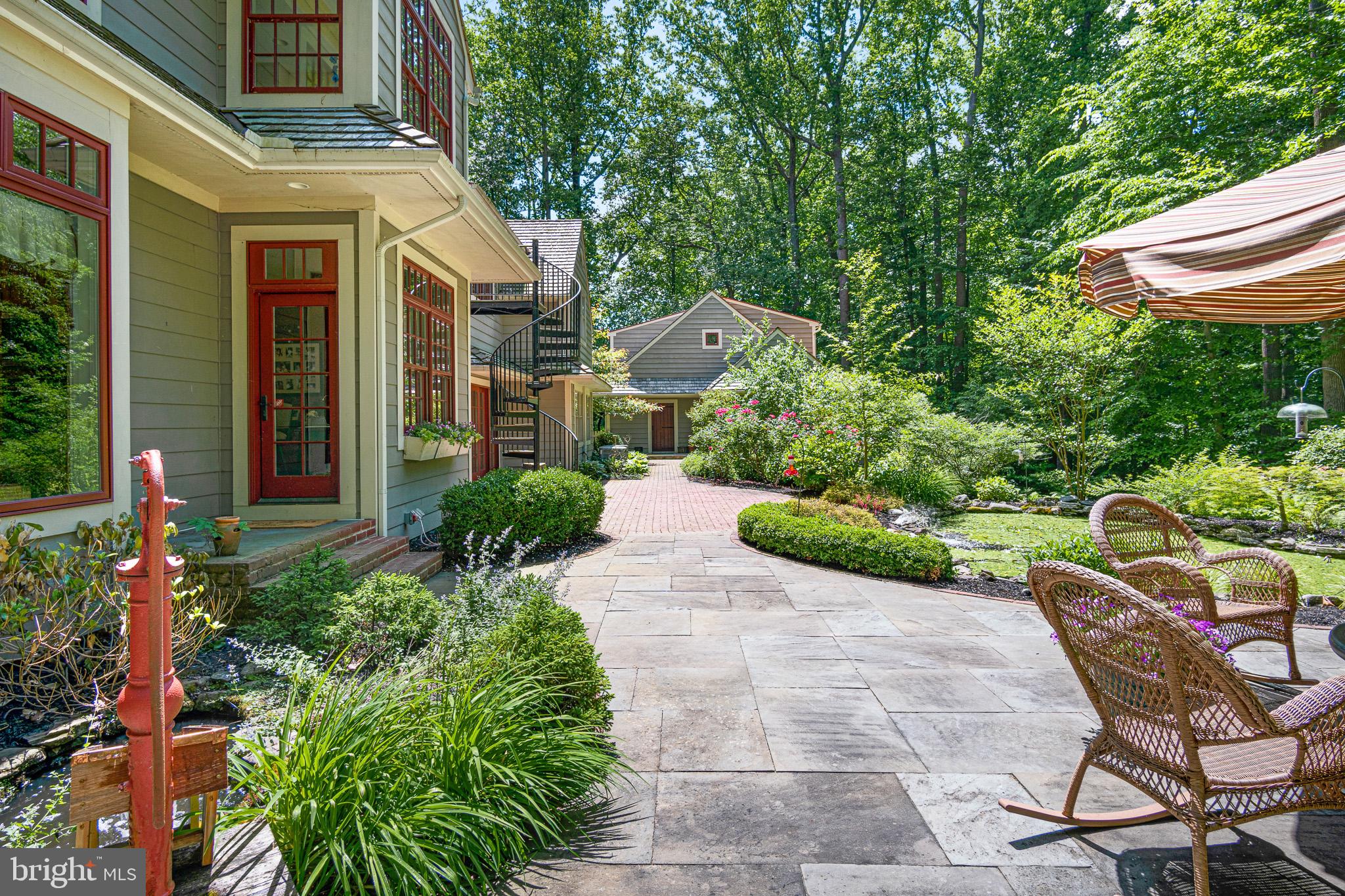 531 Webb Road Chadds Ford, PA 19317 - Photo 10 of 18 a view of a patio with table and chairs and potted plants