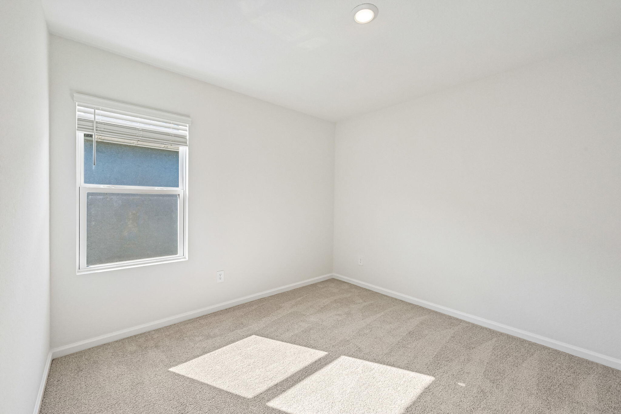 14503 Southwest New Dawn Road Indiantown, FL 34956 - Photo 21 of 42 an empty room with a window