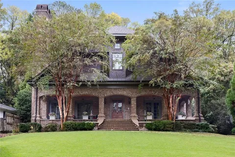 front view of a building with a garden