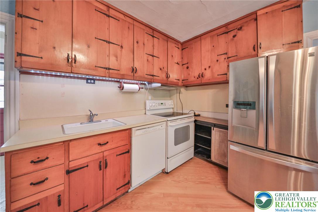 1333 Spring Valley Road Bethlehem, PA 18015 - Photo 18 of 40 a kitchen with stainless steel appliances granite countertop a refrigerator sink and cabinets