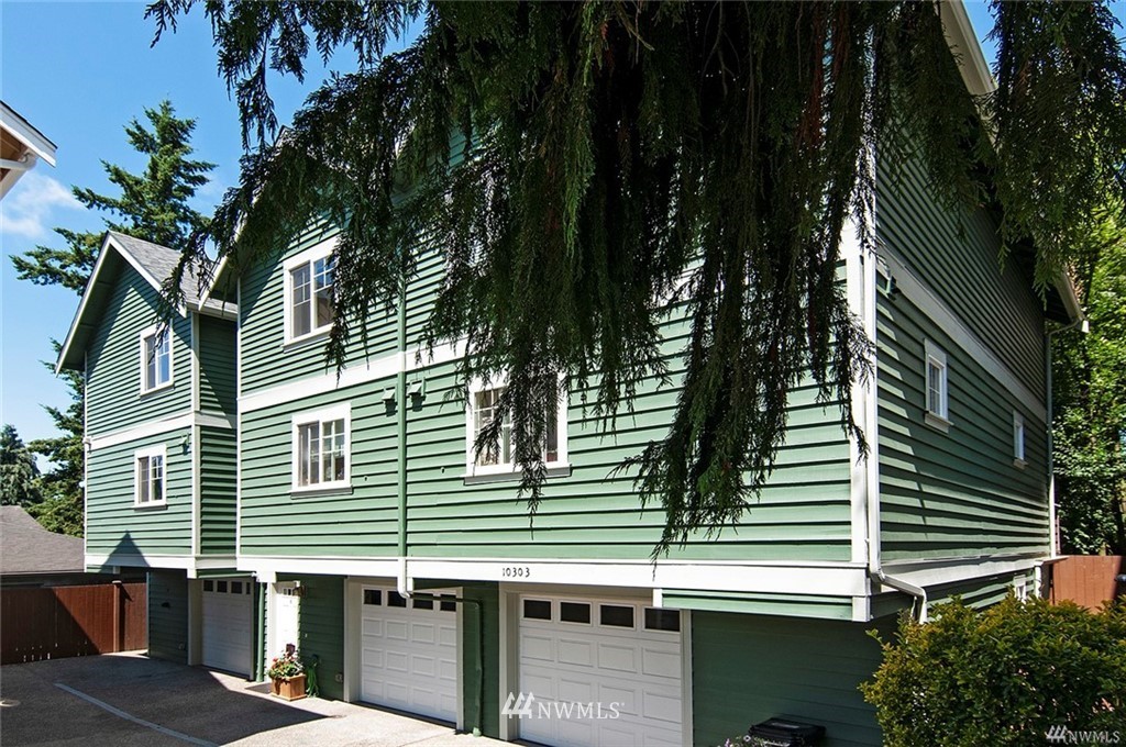 10303 Holman Road North, Unit A Seattle, WA 98177 - Photo 1 of 40 a view of a house with a tree