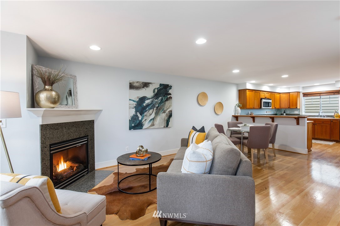 10303 Holman Road North, Unit A Seattle, WA 98177 - Photo 2 of 40 a living room with furniture and a fireplace
