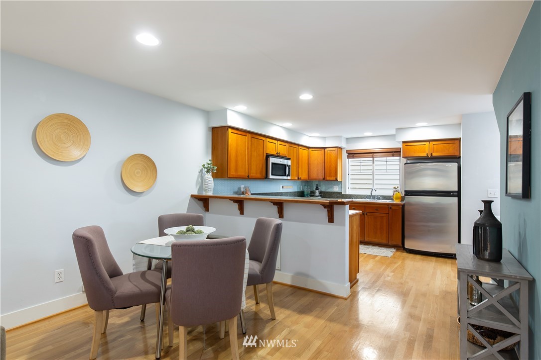 10303 Holman Road North, Unit A Seattle, WA 98177 - Photo 13 of 40 a dining room with furniture and a window