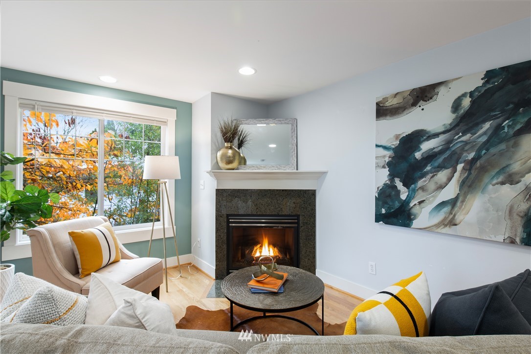 10303 Holman Road North, Unit A Seattle, WA 98177 - Photo 3 of 40 a living room with furniture and a fireplace