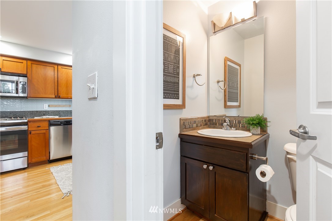 10303 Holman Road North, Unit A Seattle, WA 98177 - Photo 21 of 40 a bathroom with a sink and a mirror