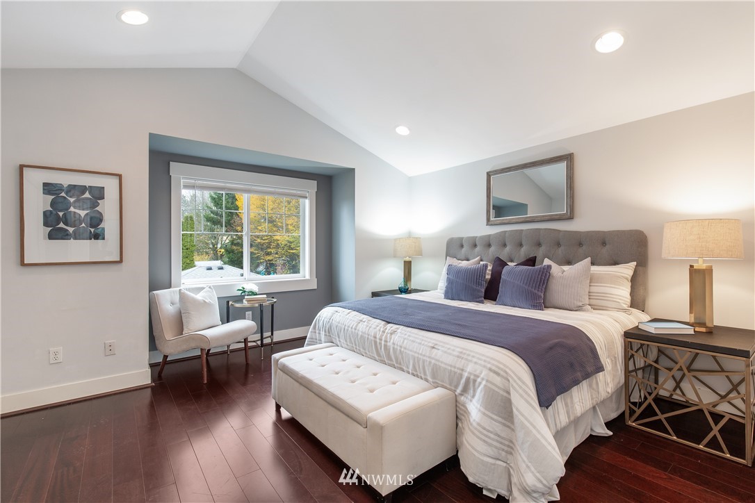 10303 Holman Road North, Unit A Seattle, WA 98177 - Photo 22 of 40 a bedroom with a bed and a couch