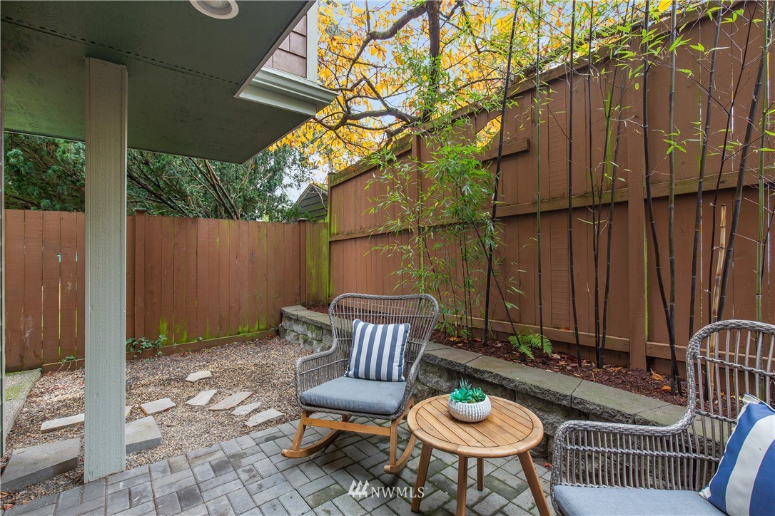 10303 Holman Road North, Unit A Seattle, WA 98177 - Photo 34 of 40 a view of a chairs and table in backyard