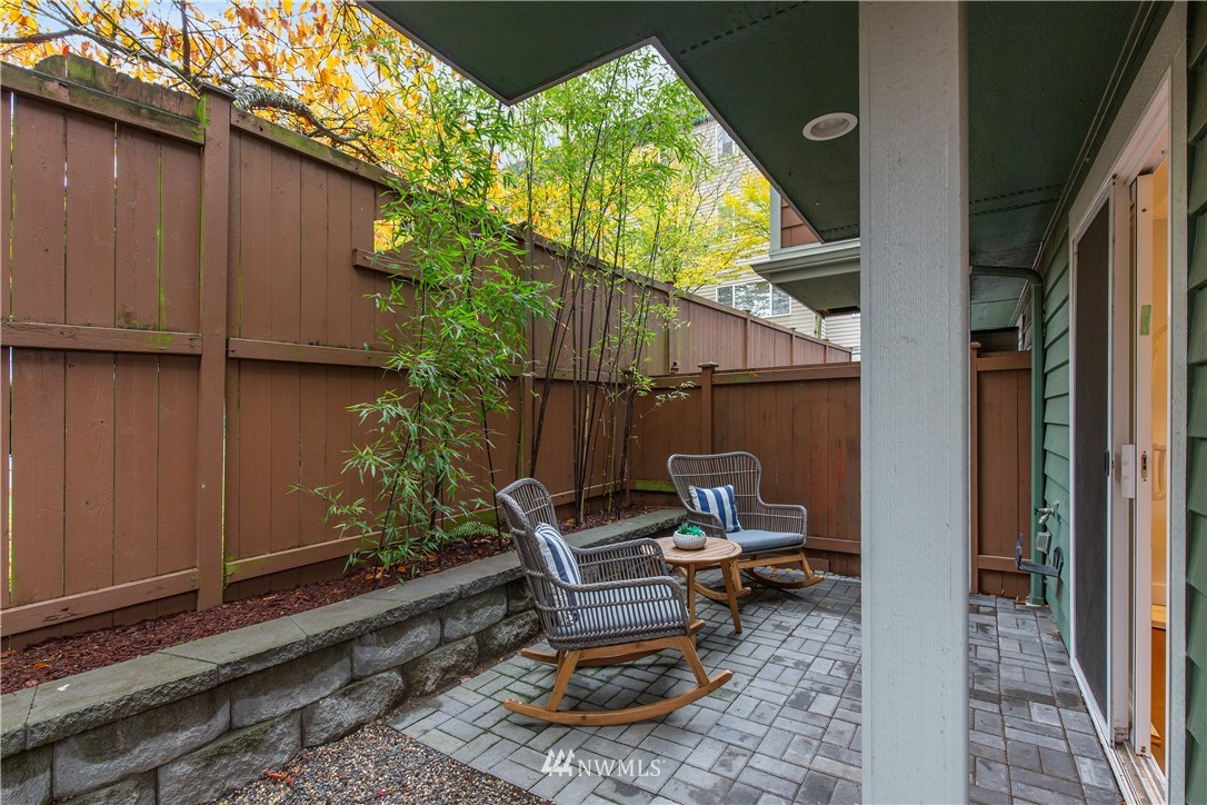 10303 Holman Road North, Unit A Seattle, WA 98177 - Photo 35 of 40 a backyard view with a garden and entertaining space