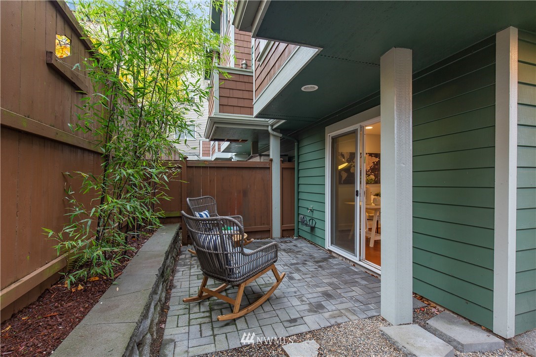 10303 Holman Road North, Unit A Seattle, WA 98177 - Photo 36 of 40 a view of backyard with outdoor seating and plants