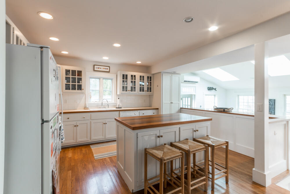 29 Clevelandtown Road Edgartown, MA 02539 - Photo 11 of 32 a kitchen with stainless steel appliances granite countertop a stove a sink and a refrigerator