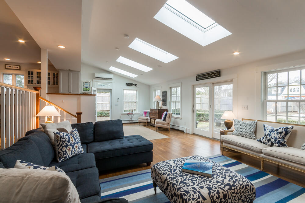 29 Clevelandtown Road Edgartown, MA 02539 - Photo 12 of 32 a living room with furniture ceiling fan and a rug