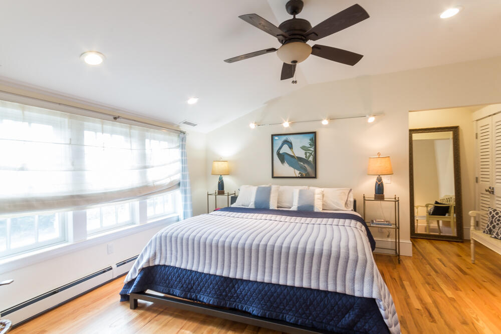 29 Clevelandtown Road Edgartown, MA 02539 - Photo 19 of 32 a spacious bedroom with a bed and a large window