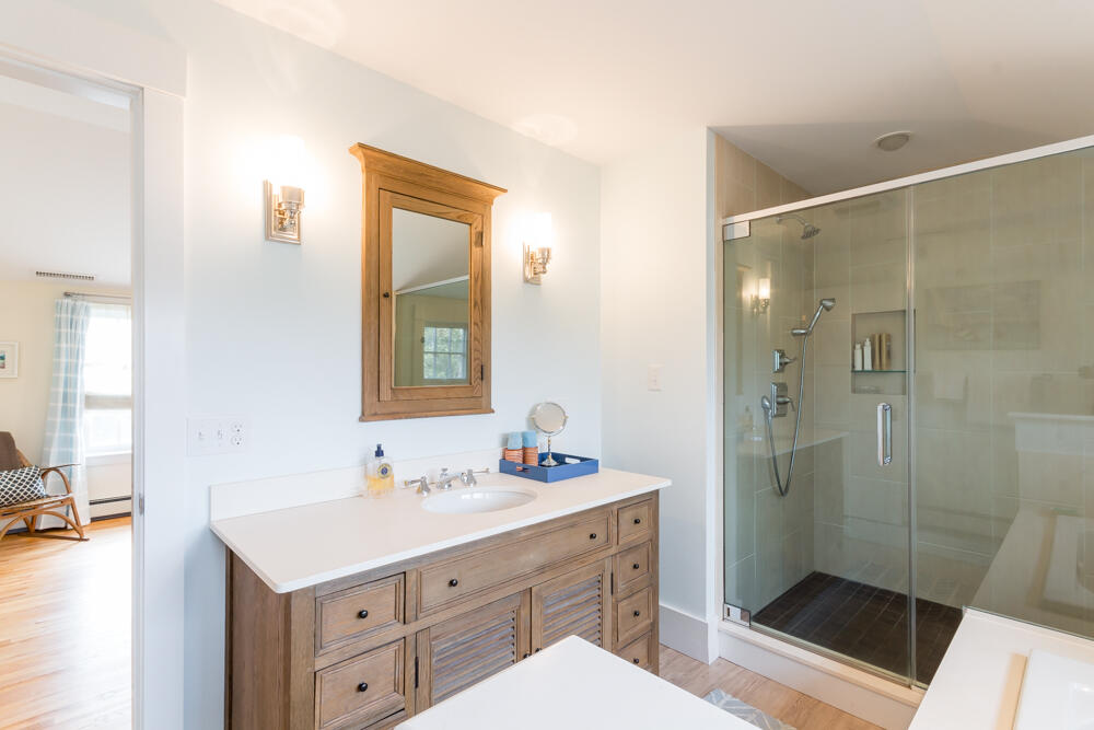 29 Clevelandtown Road Edgartown, MA 02539 - Photo 21 of 32 a bathroom with a shower sink and mirror