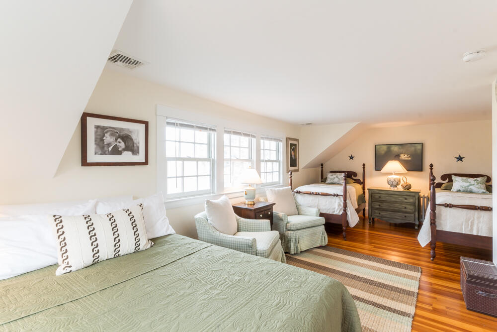 29 Clevelandtown Road Edgartown, MA 02539 - Photo 22 of 32 a bedroom with double bed and wooden floor