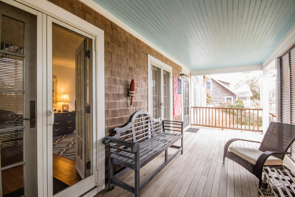 29 Clevelandtown Road Edgartown, MA 02539 - Photo 26 of 32 a living room with furniture and a floor to ceiling window