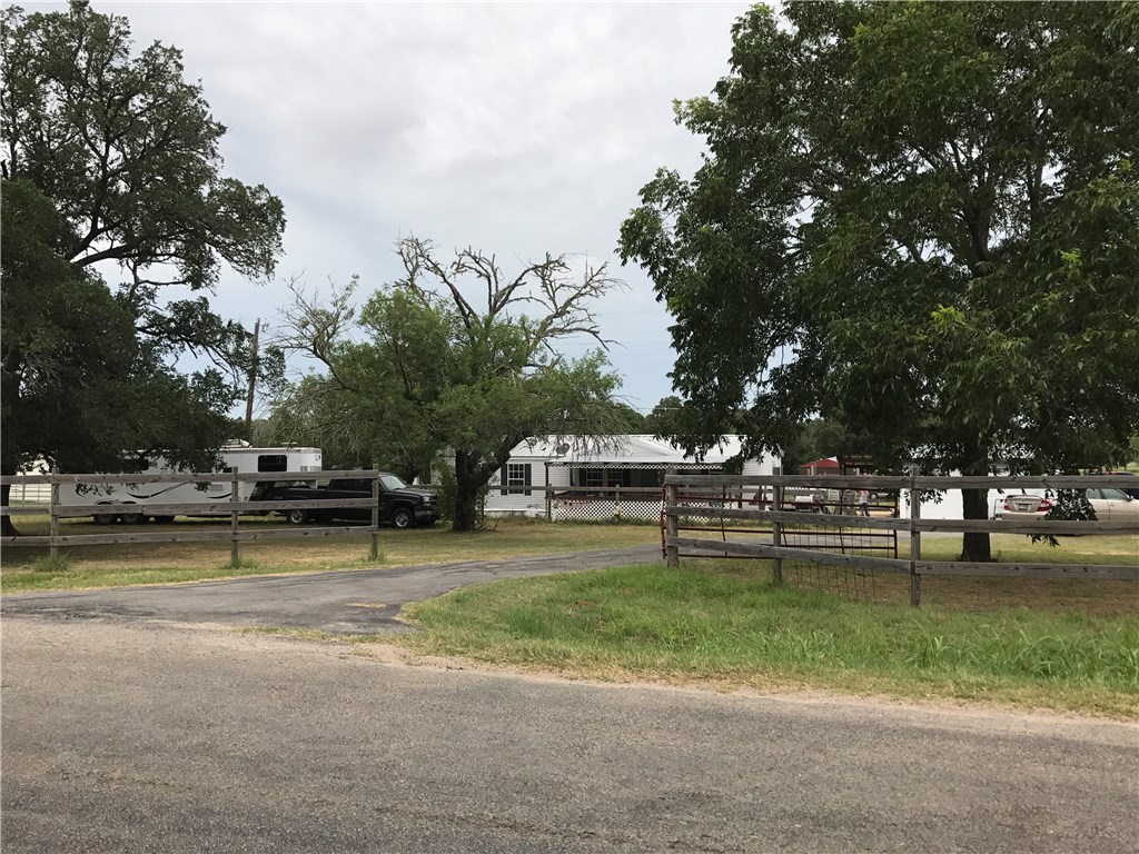 1522 Old McDade Road Elgin, TX 78621 - Photo 1 of 1 a view of a park with large trees