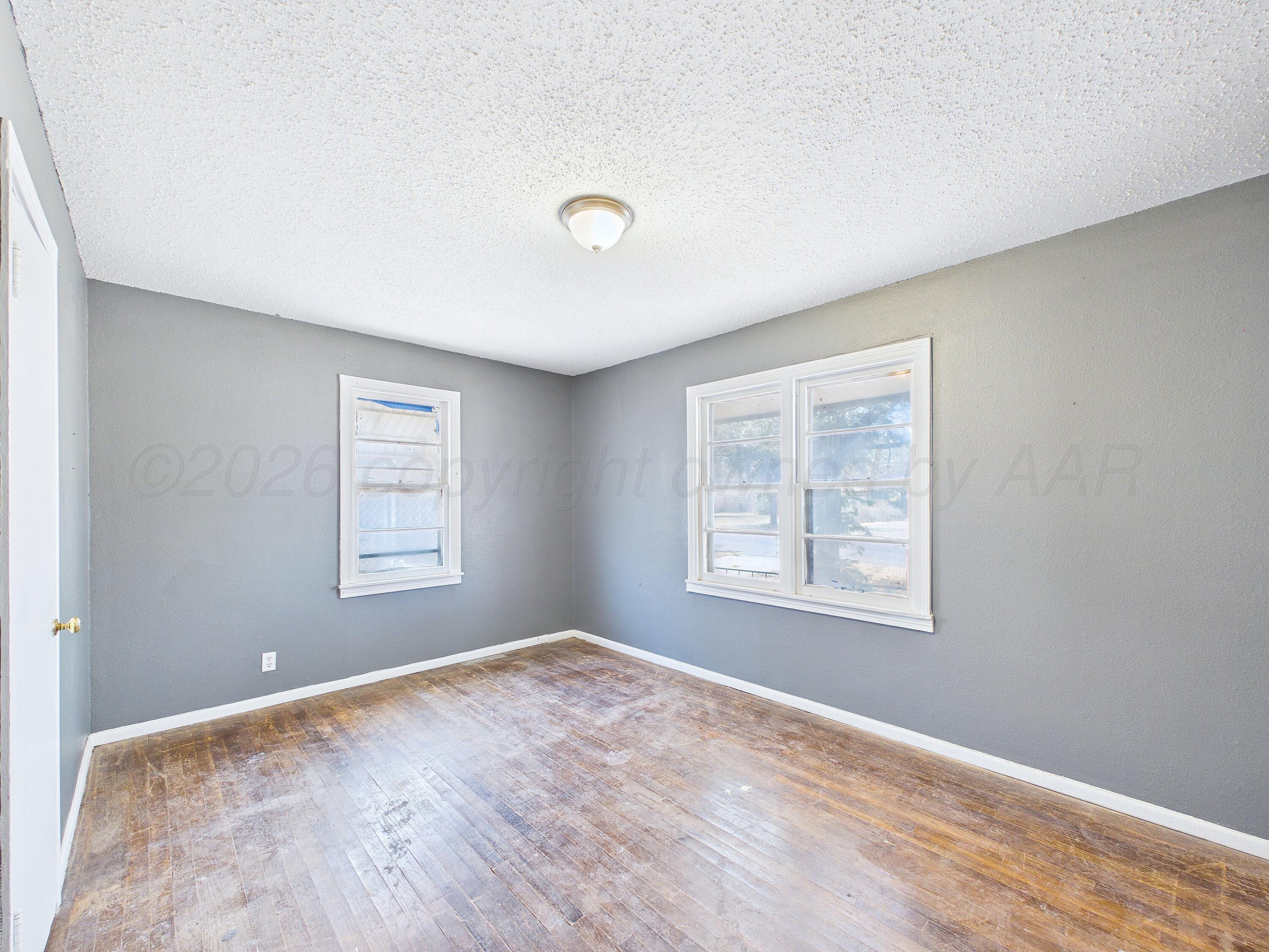 4311 Bowie Street Amarillo, TX 79110 - Photo 14 of 36 a view of an empty room with a window