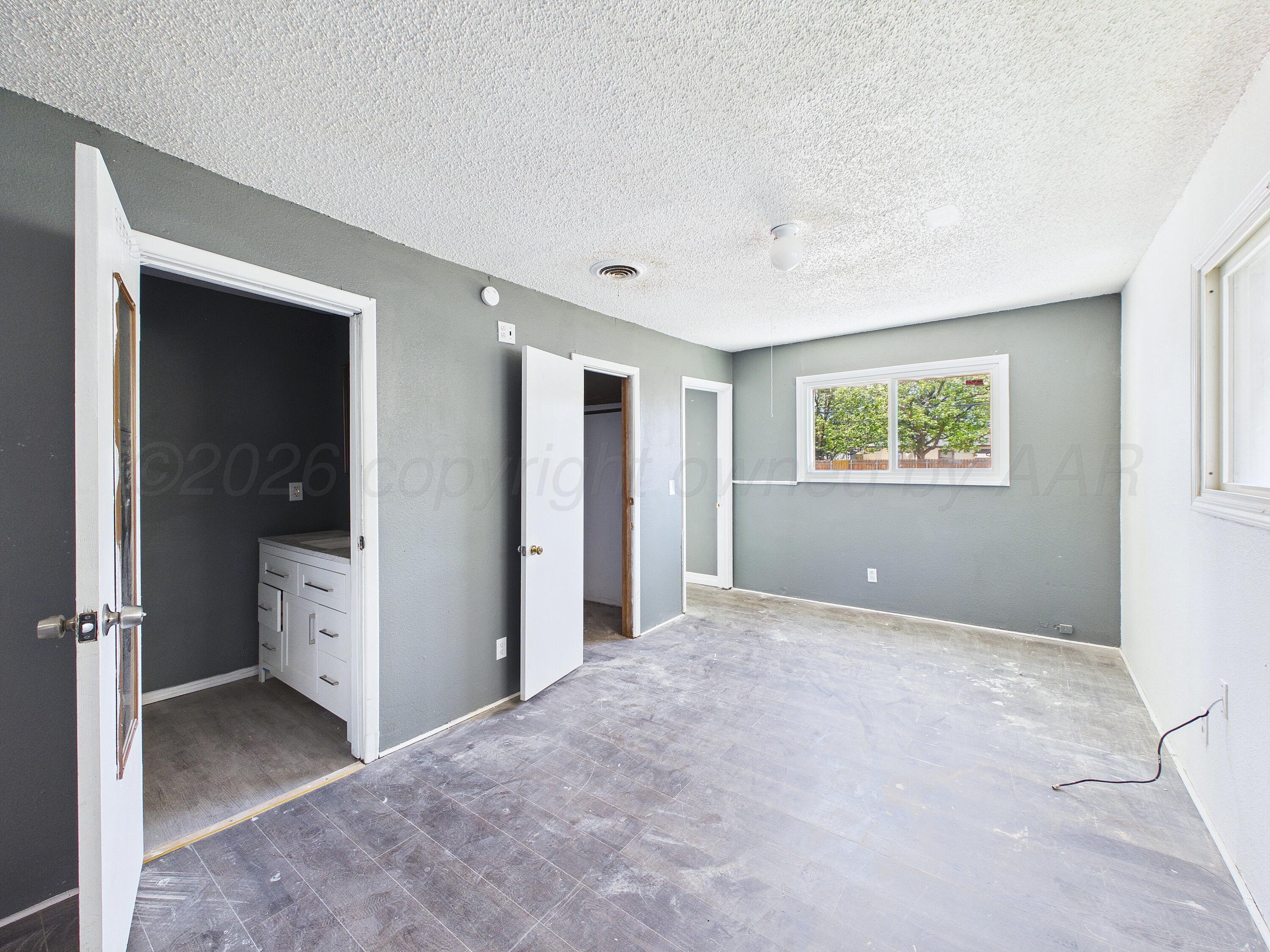 4311 Bowie Street Amarillo, TX 79110 - Photo 21 of 36 a view of a big room with windows and closet