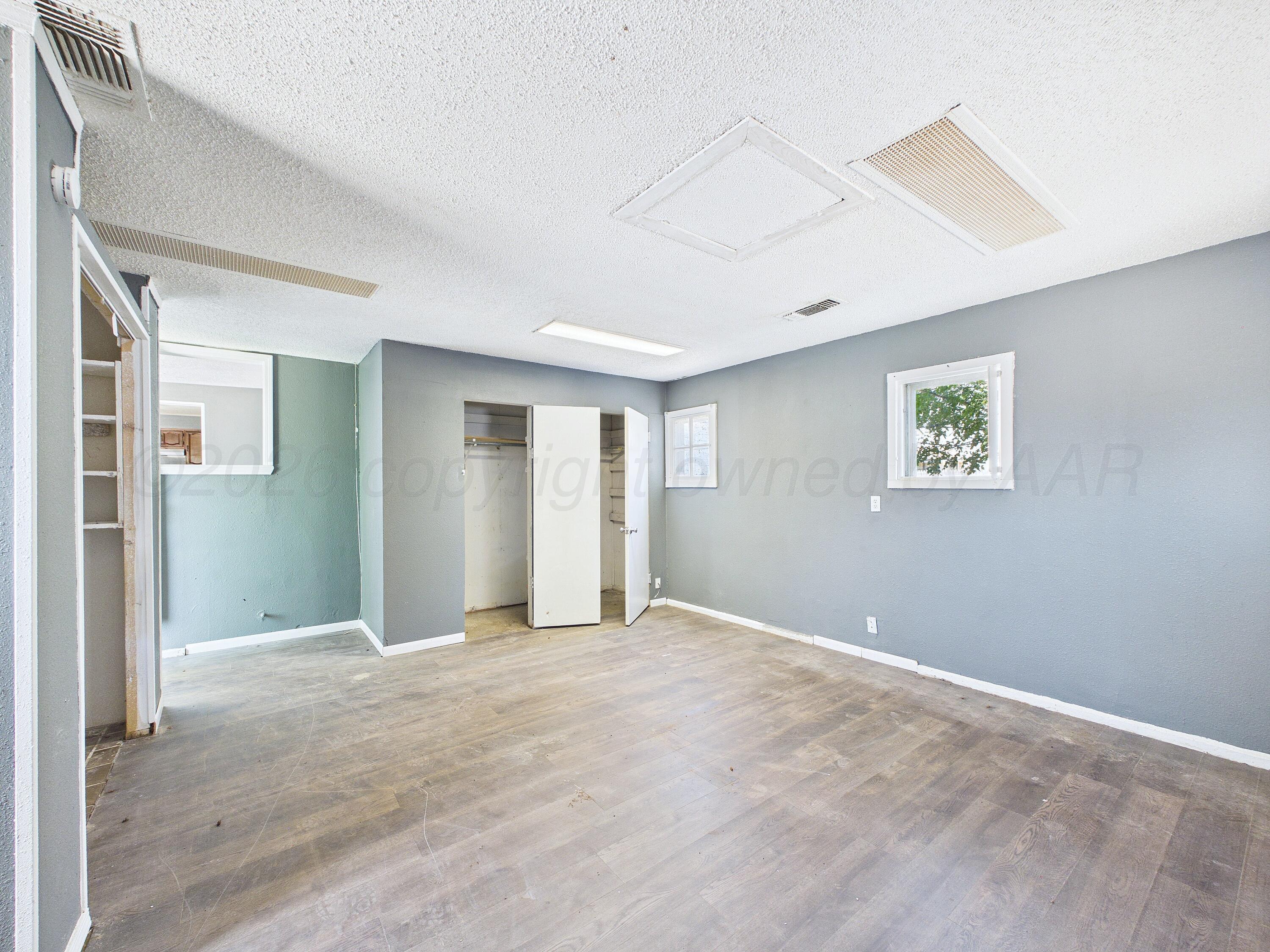 4311 Bowie Street Amarillo, TX 79110 - Photo 25 of 36 a view of an empty room with a window