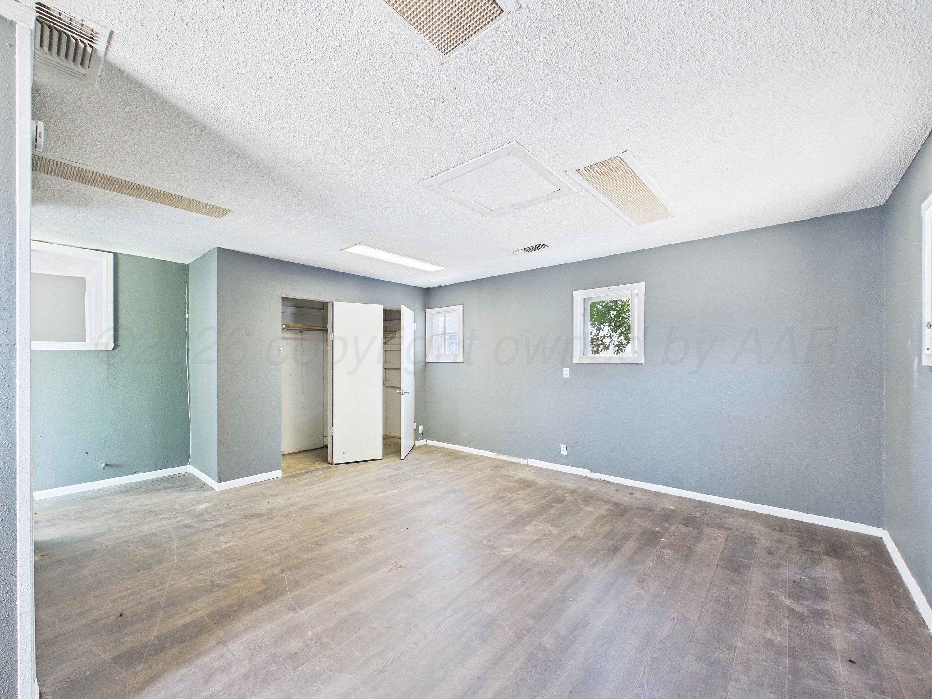 4311 Bowie Street Amarillo, TX 79110 - Photo 26 of 36 a view of an empty room with a window