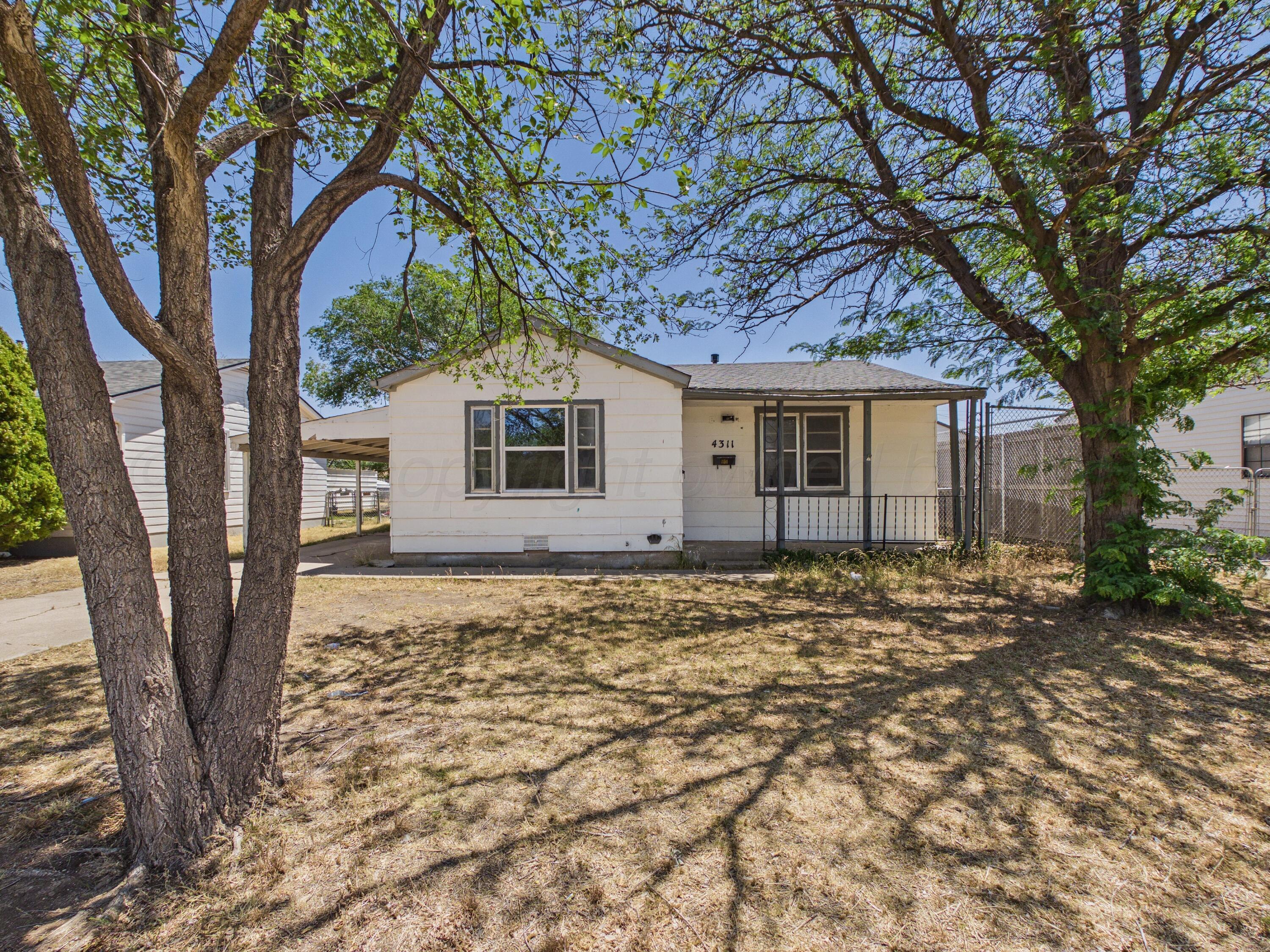 4311 Bowie Street Amarillo, TX 79110 - Photo 3 of 36 a big tree in middle of the garden