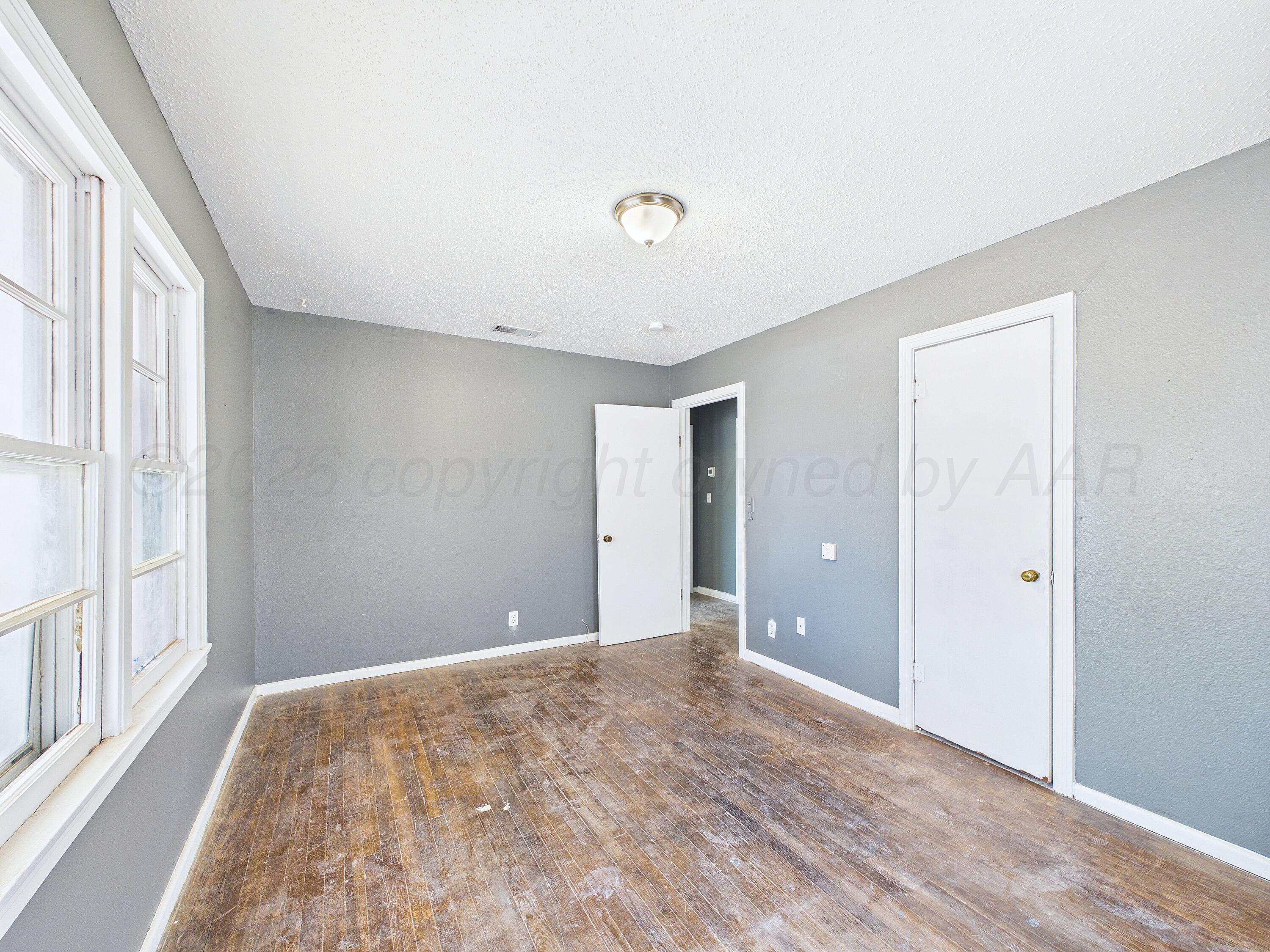 4311 Bowie Street Amarillo, TX 79110 - Photo 34 of 36 a view of room with window and a ceiling fan