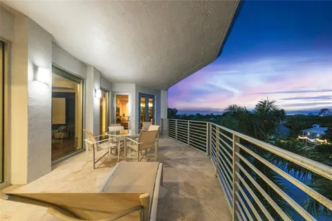 a bedroom with furniture and a flat screen tv