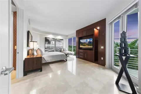 a bed room with a bed and a television