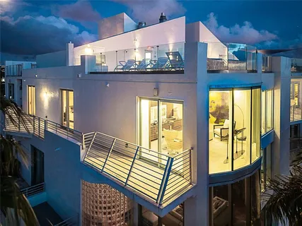 a view of a balcony with chair and wooden floor