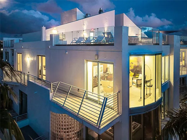 a view of a balcony with chair and wooden floor