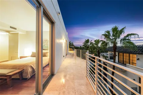 a view of balcony with furniture