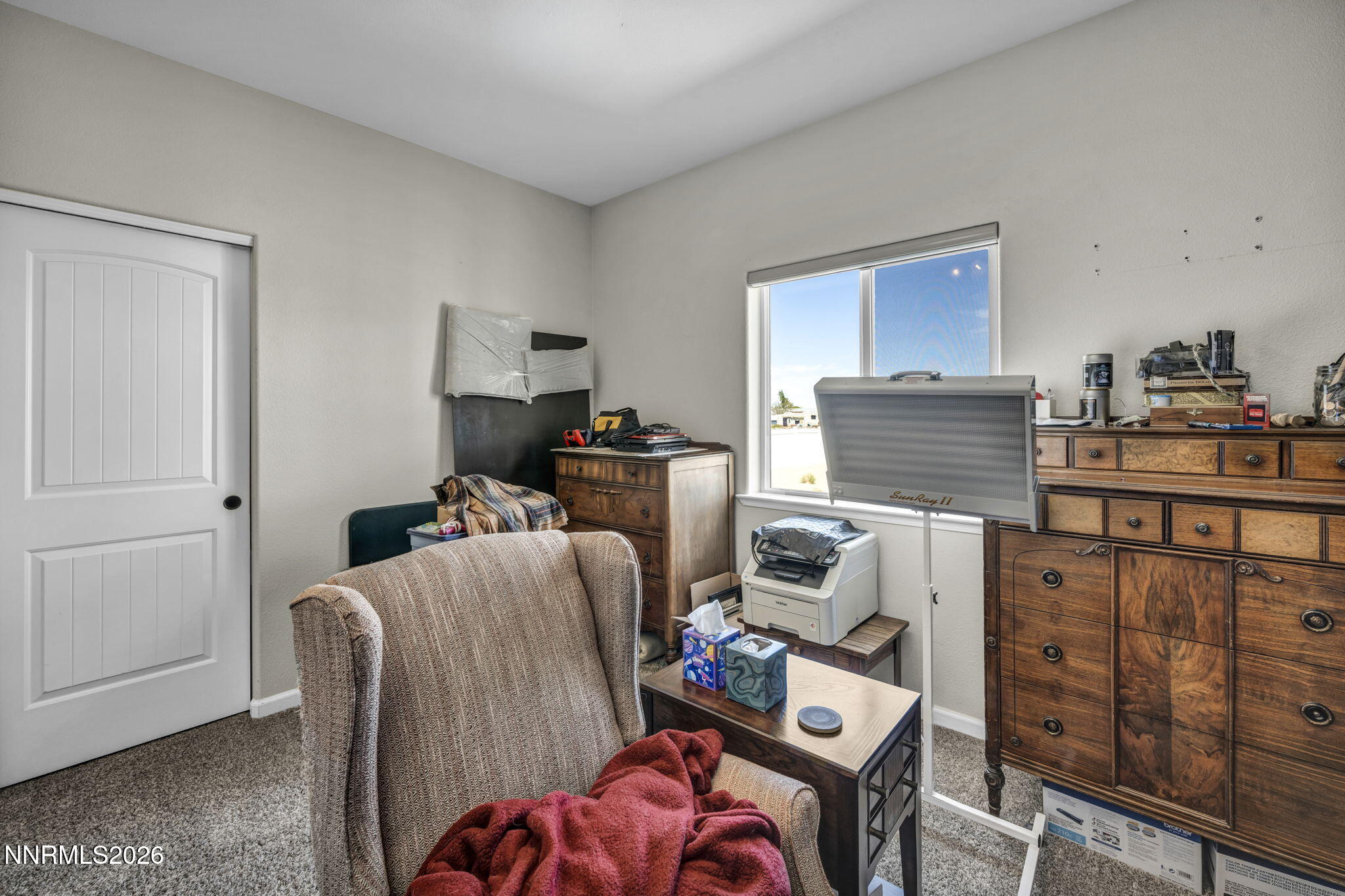 1286 Sky Ridge Drive Fallon, NV 89406 - Photo 40 of 49 a living room with furniture a flat screen tv and a window