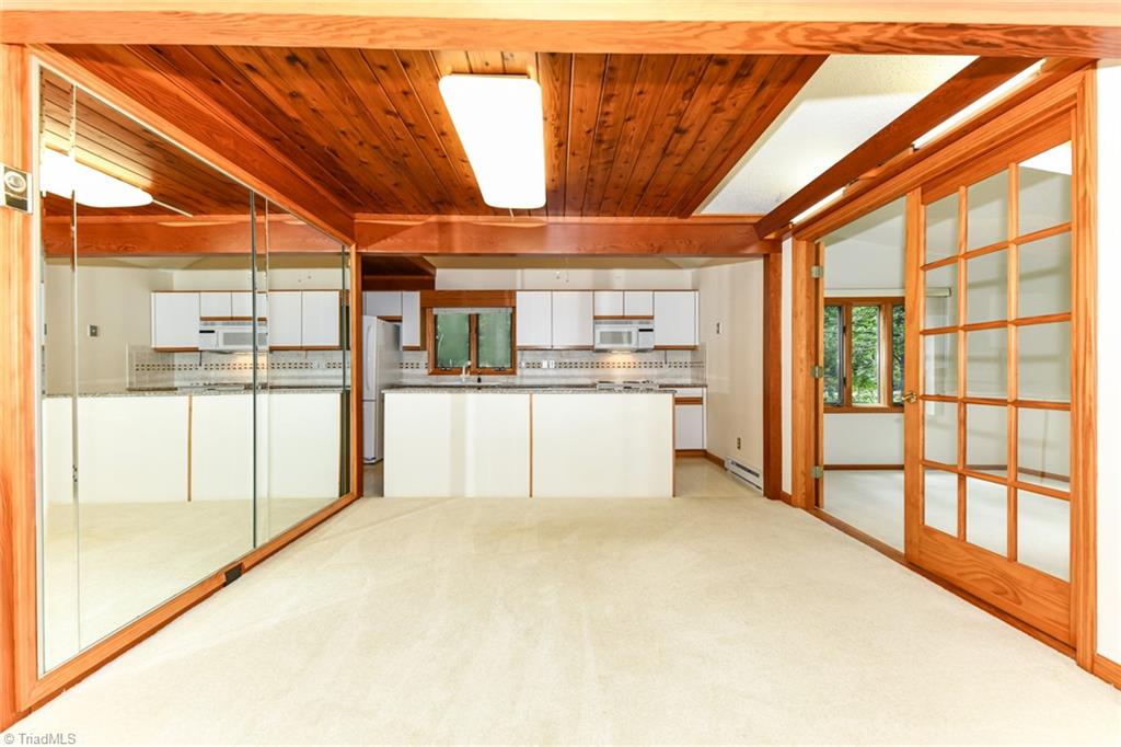 7205 Haw Ridge Road Summerfield, NC 27358 - Photo 11 of 50 Dining room and kithcen on 1st floor