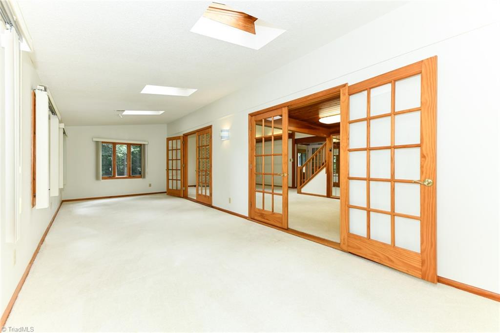 7205 Haw Ridge Road Summerfield, NC 27358 - Photo 15 of 50 Sunroom off great room (front side of house)