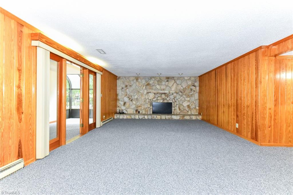 7205 Haw Ridge Road Summerfield, NC 27358 - Photo 27 of 50 Den in basement (fireplace not functional - closed off)