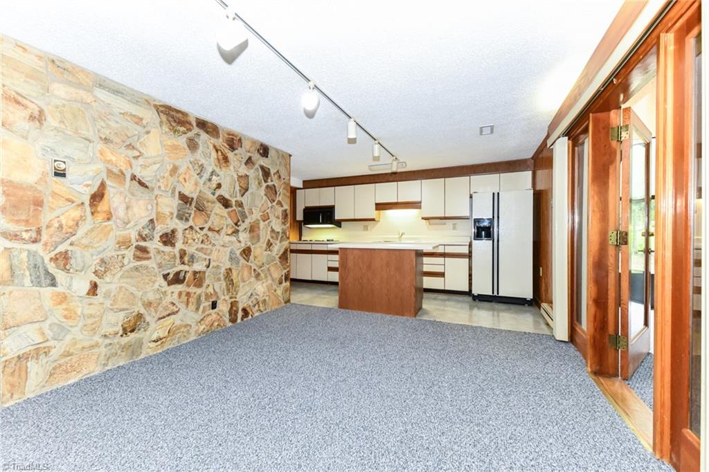 7205 Haw Ridge Road Summerfield, NC 27358 - Photo 30 of 50 Basement breakfast room and kitchen