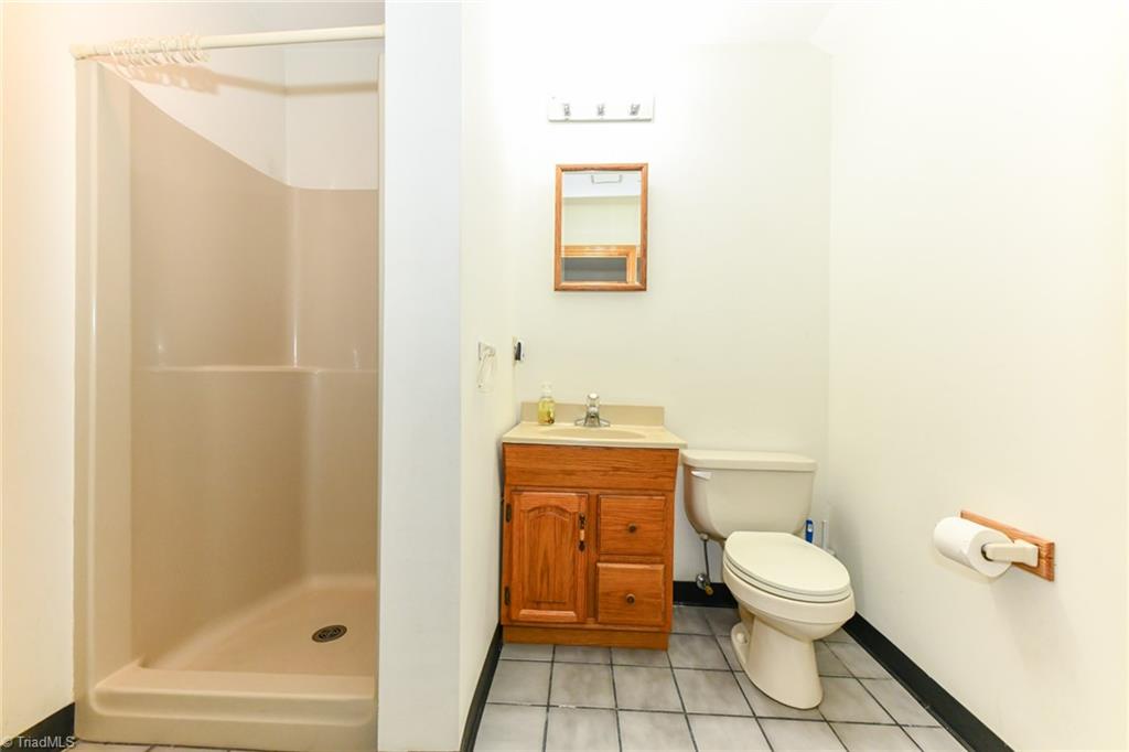 7205 Haw Ridge Road Summerfield, NC 27358 - Photo 38 of 50 Bathroom located in lower level of garage