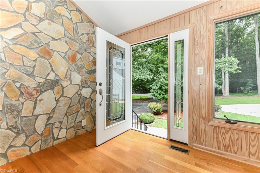 7205 Haw Ridge Road Summerfield, NC 27358 - Photo 6 of 50 Side door enters primary sunroom