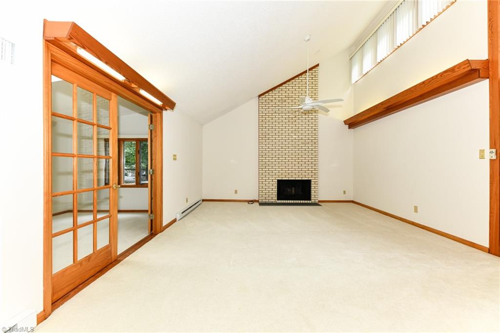 7205 Haw Ridge Road Summerfield, NC 27358 - Photo 9 of 50 Great room w/ additional sunroom to the left