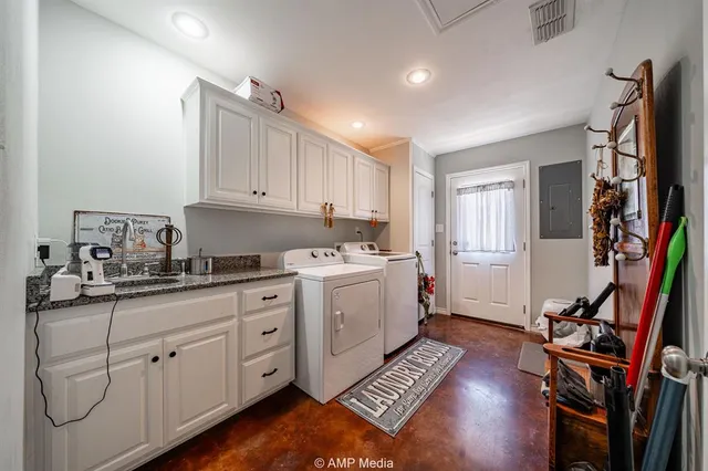 a kitchen with cabinets appliances and a wooden floor