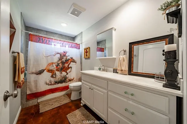 a en suite bathroom with a sink and a mirror