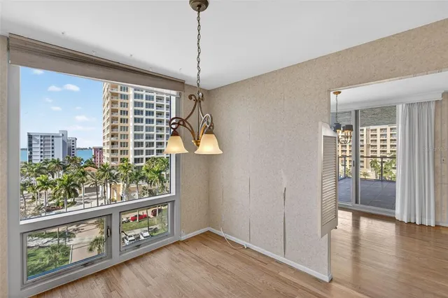 a view of an entryway with wooden floor